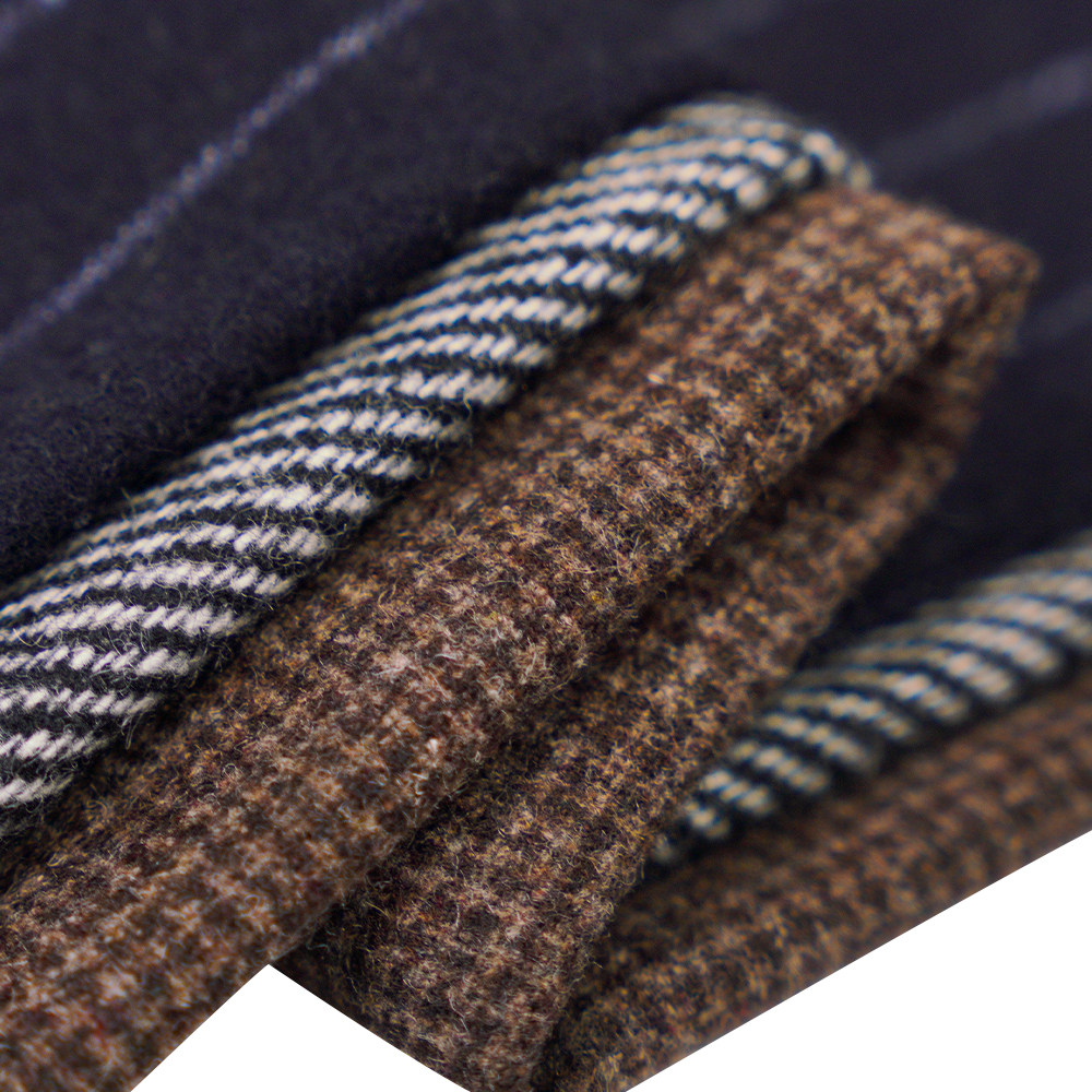 50 % lana, 30 % poliéster, 20 % otra fibra, 320 g/m, blanquecino + negro, tela de franela de sarga, ML-C-22104