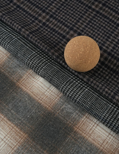 Abrigos de lana de doble cara frente a abrigos forrados de una sola capa: un análisis completo de materiales y fabricación para la adquisición mundial de prendas de vestir